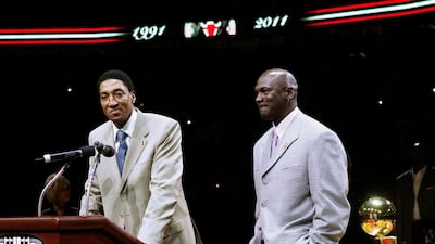 Former Chicago Bull Scottie Pippen, left, addresses the crowd as Michael Jordan and teammates from their 1990-91 season celebrate the 20th anniversary of the Bulls' first NBA championship. AP