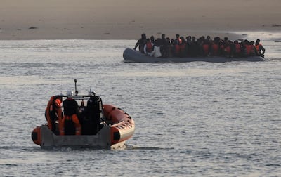 Migrants in an inflatable dinghy return to Le Portel beach near Boulogne, northern France, after an unsuccessful attempt to cross the English Channel. Reuters