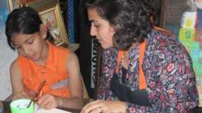 Underpriveleged children take part in a painting workshop as part of the Start summer school programme.