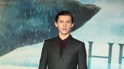 Tom Holland, in a grey Joshua Kane suit and claret shirt, attends the 'In The Heart Of The Sea' London premiere on December 2, 2015. Getty Images