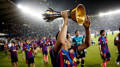 Barcelona receive their winners’ trophy after the final of the FIFA Club World Cup at Zayed Sports City on December 19, 2009. Andrew Henderson / The National