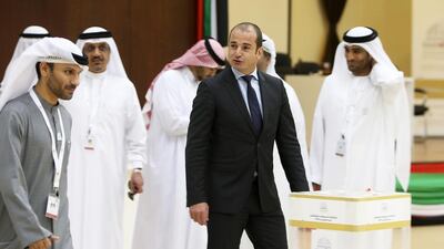 A visiting EU delegation led by Jean-Bernard Bolvin, deputy head of mission to the UAE (second from right), was at the voting centre on Sunday. Pawan Singh / The National