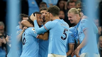 Nathan Ake celebrates with teammates after scoring for City. PA