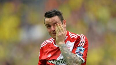 Middlesbrough’s English midfielder Lee Tomlin reacts at the final whistle of the English Championship play off final football match between Middlesbrough and Norwich City at Wembley Stadium in London on May 25, 2015. Norwich City won 2-0 to earn promotion to the Premier League. AFP PHOTO / GLYN KIRK