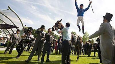 Frankie Dettori leaps from Hibaayeb after winning the Ribblesdale Stakes yesterday as owner Sheikh Mohammed bin Rashid, far right, watches on. The victory continued Godolphin's run of success at Ascot.