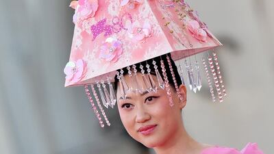 A guest arrives for the premiere of 'Lubo', at the 80th Venice Film Festival, in Venice. EPA