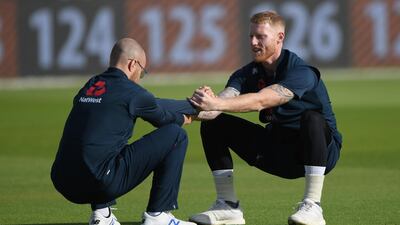 Stokes and Jack Leach stretch during England nets. Getty