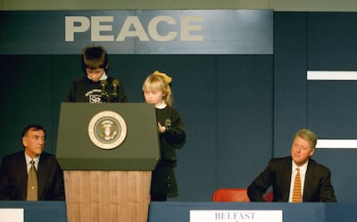 Two schoolchildren introduced Bill Clinton as he lobbied for peace in Belfast in 1995. PA