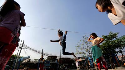 Filipino children play at a slum area suspected by the government as the ground zero of a measles outbreak in Manila, Philippines. EPA