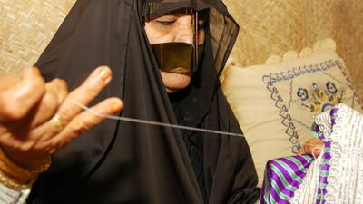 An Emirati woman creates handicrafts using traditional methods. Photo: Department of Culture and Tourism – Abu Dhabi