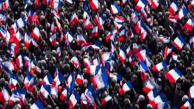 Supporters cheer as ‘Les Republicains’ party candidate for the 2017 French presidential elections, Francois Fillon, delivers a speech at the final candidate rally on the Place du Trocadero in Paris. Etienne Laurent / EPA