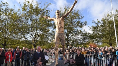 Swedish Soccer Federation general secretary Hakan Sjostrand and chairman of Malmo municipal executive board Katrin Stjernfeldt Jammeh unveil the statue. EPA