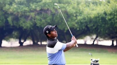 Rayhan Thomas, 16, the UAE‘s No 1 amateur golfer, during the practice session at Abu Dhabi Golf Club in Abu Dhabi. Pawan Singh / The National