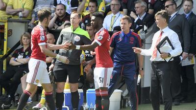 Manchester United manager Louis van Gaal brings on Timothy Fosu-Mensah for Michael Carrick during the Barclays Premier League match between Norwich City and Manchester United. Getty