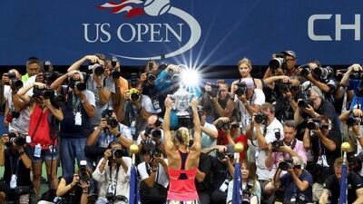 Angelique Kerber of Germany kisses the trophy. Michael Heiman / Getty Images