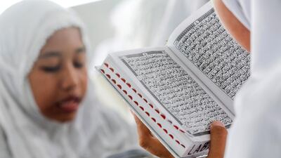 Indonesian students read the Koran on the first day of Ramadan at Ar-Raudhatul Hasanah Islamic boarding school in Medan, North Sumatra, Indonesia. EPA