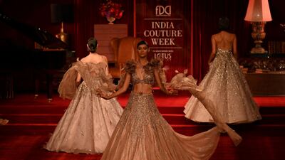 Models present creations by designer Dolly J Studio.