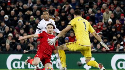 Aston Villa goalkeeper Emiliano Martinez goes to save from Liverpool's Diogo Jota. Reuters
