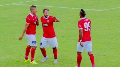 In this YouTube screenshot, Lima, left, is congratulated by teammate Everton Ribeiro, centre, after the pair combined for Al Ahli's second goal.
