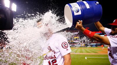 Francisco Pena of the St Louis Cardinals douses Paul DeJong after he scored a home run. Dilip Vishwanat/AFP