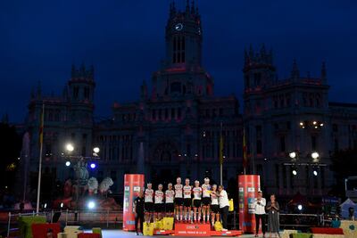 UAE Team Emirates celebrate on the podium at the end of the 2022 Vuelta after winning the Team Classification. AFP