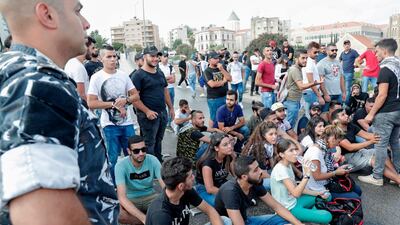 Lebanese protesters try to block a road during a demonstration near central Beirut's Martyr Square. AFP