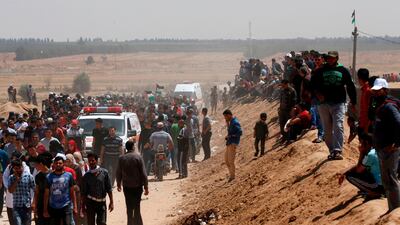 Palestinian demonstrators gather east of Khan Yunis in the southern Gaza Strip, during a protest marking 71th anniversary of 'Nakba' AFP