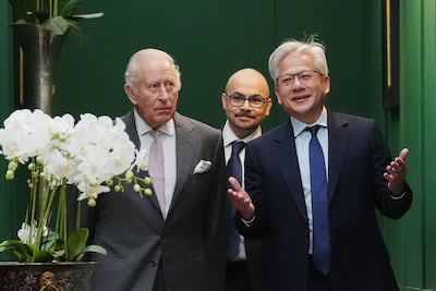 DeepMind's Demis Hassabis walks behind King Charles and Nvidia chief executive Jensen Huang. AFP