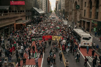 Protesters demanding an end to Israeli aggression against Palestine march in the street in Midtown Manhattan in New York City. AFP