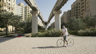 Gareth Davies on Palm Jumeirah. He loves riding, but his journey is often a mixed experience. Reem Mohammed / The National
