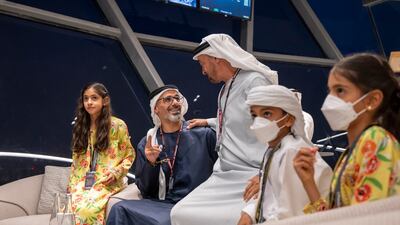 Sheikh Mohamed bin Zayed, Crown Prince of Abu Dhabi and Deputy Supreme Commander of the Armed Forces, Sheikh Khaled bin Mohamed, member of Abu Dhabi Executive Council and Chairman of Abu Dhabi Executive Office, Sheikha Shamma bint Khaled, Sheikh Mohamed bin Khaled and Sheikha Salama bint Khaled watch the action from Shams Tower. Photo: Mohamed Al Hammadi / Ministry of Presidential Affairs