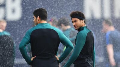Luis Suarez and Neymar look on during the training session. David Ramos / Getty Images