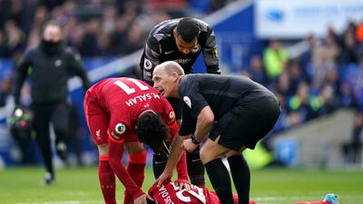 Brighton goalkeeper Robert Sanchez checks on Luis Diaz after colliding with the attacker following Liverpool's opening goal.