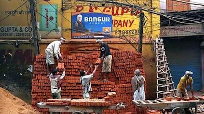 Infrastructure is slowly improving in India, but vast parts of the country still lack proper roads, water supply and regular electricity. Kevin Frayer / AP Photo