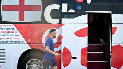 Midfielder Jordan Henderson boards the team bus. AFP