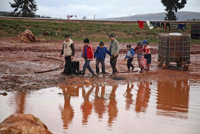 Syrian children in Cordoba camp, along the highway leading to the Syrian Bab Al Hawa border crossing with Turkey, Idlib province. Aaref Watad / AFP