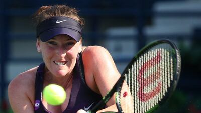 Madison Brengle of the US returns the ball to Russian Ekaterina Makarova during their WTA tennis match on the first day of the Dubai Duty Free Tennis Championships on February 16, 2016 in Dubai. / AFP / MARWAN NAAMANI