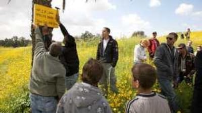 Palestinians and Israelis on a tour of the ruins of the Palestinian village of Simsim, which was vacated after 1948.