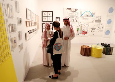 People look round the Cuadro fine art gallery at the Culture Summit. Chris Whiteoak / The National