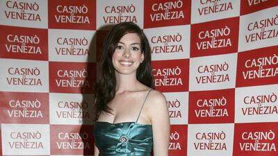 Anne Hathaway, in a teal mini dress, attends a party for 'The Devil Wears Prada' at Casino di Venezia on September 6, 2006 in Venice, Italy. Getty Images