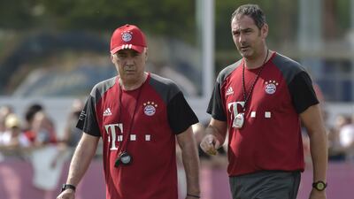 Bayern Munich's Carlo Ancelotti, left, gave Paul Clement, right, his approval before the latter left the Bundesliga club to take over the reins at Swansea City. Gunter Schiffman / AFP