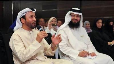 Saeed Al Kaabi, director of the Sharjah Education Zone, left, speaks at a meeting of the FNC. Razan Alzayani / The National