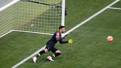 Hugo Lloris of Tottenham Hotspur dives but fails to save a penalty from Mohamed Salah of Liverpool for the opening goal. Getty