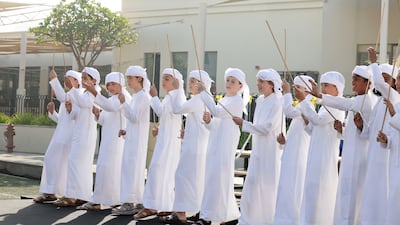Repton Al Barsha pupils, dressed in kanduras, perform a traditional dance on the campus. Pawan Singh / The National