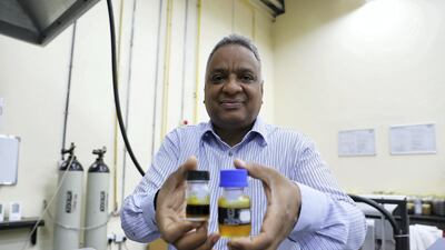 Dr Yassir Makkawi shows off the Date Palm bio-fuel at the American University of Sharjah laboratory. Pawan Singh / The National