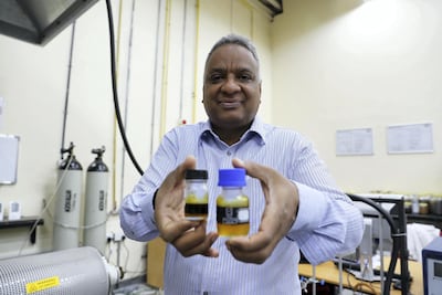 Dr Yassir Makkawi shows off the Date Palm bio-fuel at the American University of Sharjah laboratory. Pawan Singh / The National
