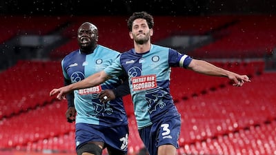 Joe Jacobson of Wycombe Wanderers celebrates with Adebayo Akinfenwa. Getty