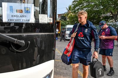 England's captain Joe Root boards the bus after the Test series against Sri Lanka was postponed. AFP