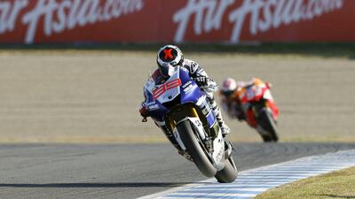 Jorge Lorenzo, front, leads Marc Marquez, back, during Saturday's Japan Grand Prix. Kimimasa Mayama / EPA