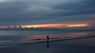 A man jogs at daybreak on a beach in Hua Hin, Thailand. Jorge Silva / Reuters